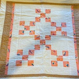 Patchwork Quilt with Peach and White Design